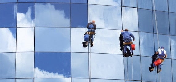 Workers washing a skyscraper windows Professional Window Cleaning london |